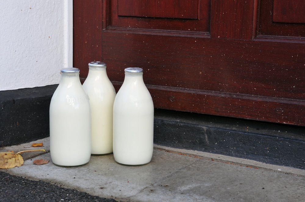 Three milk bottles on doorstep.